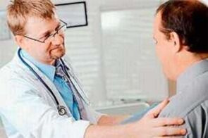 A man with prostatitis at the medical appointment